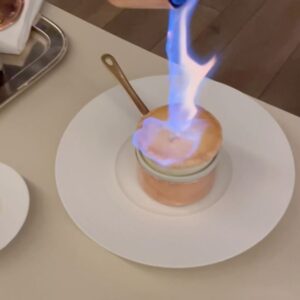 Aiste Miseviciute Instagram - One of my favorite dining experiences recently was at the one Michelin starred Saddle @saddlemadrid in Madrid, which now occupies the former location of the renowned Jockey restaurant. Jockey, a historical landmark in Spain's gastronomic, political, and cultural scene, operated from 1945 to 2012 under Clolado Cortés, who revolutionized hospitality by prioritizing the diner's experience. In October 2019, Saddle opened as a tribute to Jockey's legacy, focusing on French haute cuisine that highlights seasonal ingredients at their prime. Led by chef Pablo Laya, Saddle is dedicated to honoring culinary traditions, especially by showcasing produce when it's in season.

- Amazing, slowly roasted veal shank, tribute to the legendary chef Santi Santamaría, with potato purée and beef jus
- Butter service
- A very generous portion of Maresme teardrop green peas (gold standard of peas) and Tokaji Oremus wine sabayon
- White asparagus from Navarra, sea urchin, smoked egg yolk and vegetables soup
- The excellent wine pairing by @patrickfonsek 
- Souffé Grand Marnier
- The very impressive spirits trolley