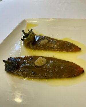 Aiste Miseviciute Instagram - Just a kilometer or so away from Bilbao Airport lies Spain's best-kept secret, Asador Taskas @asador_taskas. Although this seafood temple may have a surprising location, its stellar ingredients and impeccable grilling techniques merit a special trip not only from the airport arrivals. Whether it's superb Galician clams, giant langoustines, or the king of all fish, Cantabrian El Rey, Taskas owner Ángel Leon sources only the best ingredients from the Spanish seas. Here, time stands still, and you are transported to the ultimate seafood and ingredient temple, without any doubts, among the best in the Basque Country.

In the pictures

- Squid filled with caramelized onions
- Anchovies
- Home marinated salmon with orange sauce and black salt
- Green peppers 
- Grilled cigala
- Magnificent El Rey fish