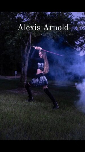 Alexis Arnold Instagram - Ninja training #ninja #ninjaintraining #ninja #sword #samurai #blade #actress #model #alexisarnold #alexisarnoldactress #alexisarnoldmodel #pink #longhair #martialarts #kneehighsocks #attack #tiktok #instagram #nunchucks