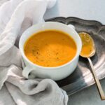 Ali Larter Instagram - I hope everyone is having a beautiful Sunday! I got a lot of requests for this carrot ginger soup so I’m sharing the recipe. It is so bright, tangy, creamy, healthy and delicious. My kids love it too. Enjoy! 🥕🥕🥕Sauté 1/2 cup onion in 2 TBLS coconut oil, add 4 cups carrots, 4 cups veg broth, 1 cup orange juice, 1 TBLS grated ginger, and a squeeze of lemon. Simmer for 20 minutes, purée and then return to pot and stir in 1 can of coconut milk. Salt and pepper to taste. 😘