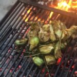 Alice Waters Instagram - David Tanis cooked baby artichokes on the grill for HIS OWN birthday! Just a few vaccinated friends were gathered in Sue's yard for a little dinner and a rosé toast. It felt almost civilized...Of course it was delicious: Fanny made a special cardamom cake and Sue made her divine fava bean pasta.