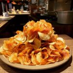 Alice Waters Instagram - I cannot tell you how addictive the potato chips are at Chez! The fried rosemary is the crowning touch. Thank god they come in small boxes "to go" and that I am embarrassed to order 10 small boxes! Thank you to the cafe cooks at Chez especially Sam.