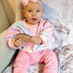 Alicia Banit Instagram - 7 months of our Isla Joy! This little possum has a top tooth, has tried more foods than I can count and babbles MAMA among other words! I’m not sure she knows what she’s saying but I’m claiming it, her first word is definitely mama! She watches our mouths so intently when we try to teach her new words and she’s back in her dinosaur era roaring at everything. She whispers to herself and breathes like darth Vader when she’s bored and I honestly have never met a more smiley, laughable bub. Even through her first cold, our girl didn’t have a single day where she didn’t laugh and smile her way through it. We couldn’t be more in love with her, she is pure perfection 🥹