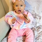 Alicia Banit Instagram - 7 months of our Isla Joy! This little possum has a top tooth, has tried more foods than I can count and babbles MAMA among other words! I’m not sure she knows what she’s saying but I’m claiming it, her first word is definitely mama! She watches our mouths so intently when we try to teach her new words and she’s back in her dinosaur era roaring at everything. She whispers to herself and breathes like darth Vader when she’s bored and I honestly have never met a more smiley, laughable bub. Even through her first cold, our girl didn’t have a single day where she didn’t laugh and smile her way through it. We couldn’t be more in love with her, she is pure perfection 🥹