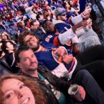 Alicia Witt Instagram – SOMUCHFUN was had this weekend!! what a blast to take a quick jaunt to nyc to watch the @ny_islanders WIN their playoff game against the @canes. now for tomorrow to stay in it! i’ve got my very own team jersey and so does @theimportanceofbeingernesth for good luck ☺️ congratulations to my friend, islanders and @ubsarena owner #jonledecky, and thank you for the most special weekend. also pictured: a whole bunch of @nyjets who were there to cheer us on, especially awesome sauce @malikktaylor who i sat next to for first period – and fellow christmas movie alumnus, @wesbrown225, who was attending as a longtime #islanders fan too!! 

🧡💙

#goislanders #hockeyplayoffs