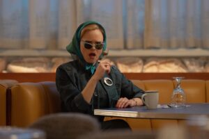 Alison Pill Instagram - My face when I hear you haven’t watched #hellotomorrow on @appletvplus yet.  Episode 4 out now! (Image description: a white blonde woman in scarf and sunglasses sitting at a diner table with a look of disgust/horror)