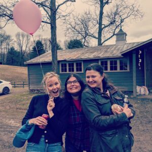 Alison Pill Instagram - First day of spring means balloons, face paint, and friends. @anaorellano @jpworsham [image description: three people outside with trees and a barn in the background, one with face paint and a pink balloon, all with big smiles]