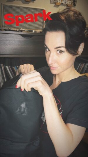 Allison Scagliotti Instagram - What’s in the bag?? Just a few of my favorite things. Beyond pumped to take this artsy Spark Mini and portable Riff interface on a winter road trip. Paired with the new Omnyss effects collection, things are about to get heavy. Loving the custom Spark x You Mondrian grill. 

Cables, picks and stickers from @ernieball 
CBD tincture from @offgridblends 
Vegan serum from @byroe_official 
Hot sauce from @dawsonshotsauce 
Golden hydration from @liquiddeath 
Mysterious creativity cards from @thechrishau 
And road ready Spark Mini   Riff interface by @positivegrid.
