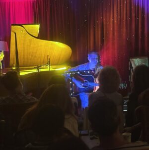 Amanda Palmer Instagram - Scenes from one of the last shows at @gravesidevariety last night with @gollypresents - @hollymiranda and @graciecoates bringing the love to a sold out crowd, and for the algorithm, @stormof69 taking over the drawing table. We are gonna shutter this amazing pop-up cabaret avant-garde venue experiment in the woods JUNE 1. 

I’m gonna miss this place so much, but we are going to move down the street for chapter two. And look what we DID. Tonight I’m hosting my last lock-in “private practice” solo piano show for patrons and close friends and I’m so exciting. I’m gonna take requests and play patreon requests from a post I made a few days ago, bring on some special guests, and play some fetal unfinished @dresdendolls songs. I’m filming a select part of the night for patrons so join. Liz Grammaticas (@insta_grammaticas) has been holding down the fort so beautifully … and we are closing with. BANG before the next chapter and new management and era unfolds about a half mile away in a new building. 🎉♥️💃🔥

Liz and I are also putting a HUGE wrap post/memorial/scrapbook together for the patreon, and it’ll be public. I’ll share it here. 

Our hearts are full. 

Go to @gravesidevariety for the final few shows!! My daytime author talk with Leslie Jamison on Sat June 1st at 1pm still has a few tix and will be 🔥🔥🔥👌

Holly photos by @insta_grammaticas, rest my me. ♥️🎉🎉