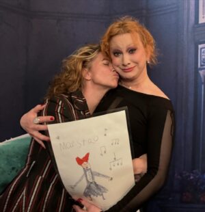 Amanda Palmer Instagram - So many worlds colliding. Musical theater, drag, the @dresdendolls, my kid, fan art, and circular thank you notes. 

This is 1) me and @thejinkx holding my son Ash’s first fan art, and what an unbelievable full circle moment. Jinkx is a longtime @dresdendolls fan (she was in the old school brigade as a baby theater geek teen in Portland) who exploded to stardom and won Rupaul’s drag race…twice. 

History just collided when Jinkx played a role in a recent Dr. Who episode as a non-binary evil music-eating monster called “THE MAESTRO” - 3 and 4, can we talk about the LOOK HERE PEOPLE ♥️♥️♥️ - and Ash was smitten and made…his first fan art. Luckily Jinkx was nearby playing Audrey in an off-broadway run of “Little Shop of Horrors”, so we got to see the show and deliver the art IN PERSON….(plus special treat @jimmycarp as the sadistic dentist, shown here in slide 2, he was BRILLLIANT in the role goddamn). I wept real tears when Jinks sang “Somewhere That’s Green”, and Ash got to deliver his Maestro fan art. I got to have a really good long sushi sitdown with Jinkx and talk about life and art and stage and work and power. I think we have found our people. Does life get better than this?

Well, there’s always the rub. Jinks posted this photo to her feed and I was reminded that there are a ton of people out there who have encountered me only via TikTok memes who think I’m a terrible person. Whatever, people. I am so much bigger on the inside. 

I love this life, these circles, this explosion. 

Jinkx is heading to reprise her role as Mama Morton in CHICAGO on Broadway in a few days…head that way, please, and cheer extra fucking loud. 

Saying thank you is important. In every direction. Jinkx put us on the list for the show and the final slide is Ash’s thank you note after seeing Jinkx’s show. 

Three words. You. Did. Great. 

HAPPY PRIDE MONTH, fellow theater queers. I see you all and love you. Don’t let the bastards get you down. And give Jinkx a follow. She’s putting the art first and this is a performer of total integrity to follow alllll the way. 

♥️🎪🎹💃🌈💖🏳️‍🌈🏳️‍⚧️💚🎭