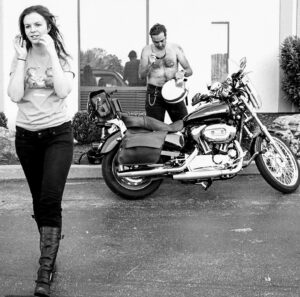 Amber Tamblyn Instagram - My least favorite person and 17th favorite poet is 50 years young today (yesterday, really) and I can’t believe how many poetry tours on motorcycles, arguments in bars, impromptu shows in living rooms, lifeguard towers, and double decker buses we’ve been through together— how many cigarettes we’ve wanted to put out on each other’s faces, how many bottles of bourbon we’ve raced to the bottom of, how many people’s broken hearts we’ve shattered or helped put back together again, how many horrible, honest, holy moments we’ve shared along the way. Twenty years to be exact. (See our first show flier from Upright Citizens Brigade in 2004.) We were such young puppies in some of these pictures taken by @mattwignall across too many tours and cities to count. Now look at us: too old to party and too hot to handle. 

Happy birthday, brother. I love you, occasionally. Someday I hope they write a movie about your crazy life and cast a less attractive, semi-talented Harry Styles. Until then, nothing can imitate the real thing: you, and what you’ve got, and what you’ve given to the world.

“Teased by success, 
we are like vampires in a tampon factory. It doesn’t have to be that way. 

Someone plug my lungs back into the guitar amps. All distortion, all the time. 

Aren’t you sick of being appraised wholesale? Aren’t you sick of sailing on listing ships? Aren’t you weary from playing cello with ex-lover’s bones?

I am.”

-All Distortion All The Time, Derrick Brown

#DerrickBrownPoetry