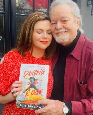 Amber Tamblyn Instagram - Happy publication to my amazing papa, @officialrusstamblyn who is publishing his first book today at 89 years old. Don’t ever say you’re too old to accomplish one of your life-long dreams. So proud of you, dad. These stories about your life as an artist are unparalleled: sharing the screen with Elizabeth Taylor, teaching Elvis Presley some of his most famous dance moves, and smuggling Paul Newman off the MGM lot in the trunk of your car. And that’s just the first three chapters. 

Extra big shoutout to his co-writer, the brilliant Sarah Tomlinson, and Blackstone Publishing. Link in my bio to order your copy today! #RussTamblyn
#WhenYoureAJet
#DancingOnTheEdge