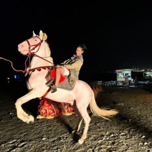 Amrit Kaur Instagram - On my travels to Pakistan, I encountered this kindred spirit. I’ve been studying horses and their movements for about a year, as part of an acting exercise. As we were setting up for a movie shot, I kept on escaping to spend time with Dudu. Yep, that’s him, the charming ivory horse who I met at the French Beach in Karachi. I mean, he did greet me by peeing beside my feet, but aside from that... ha!...very charming. He’s so beautiful he doesn’t look real. It is an animal close to my heart and seems to keep reappearing in my life - and Pakistan has so much respect for these animals. They’re everywhere: groomed, celebrated, clothed and deeply loved like family. Love you Dudu. Love all the horses. Till we meet again xo
 
 #horses #animalwork #study #gracemoonarts #acting #culture #love #Pakistan