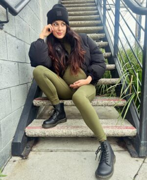Amy Maghera Instagram - My little bump and I in @bumpsuit 💚 Their puffer jacket and all in ones are honestly my preggo uniform as they are just sooooo comfortable!! Use my code AMYMAGHERA for 20% off 😀