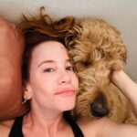 Amy Davidson Instagram - Last night snuggles with Clifford. 🐶🐾🐾Well, he actually pinned me down and I couldn’t quite move without waking the sleeping baby. Lol! I think his head weighs like 10 pounds. do your dogs hold you captive?! 😅 I mean, the poor guy was obviously sooooooo tired. It’s such a ruff life eating, sleeping, walking, barking at everyone and everything ALL DAY! I hope you got your beauty sleep, buddy. I love you!