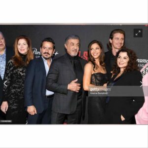 Andrea Savage Instagram - So thrilled to be in nyc for the @tulsaking premiere!! What a fantastic night!! I truly felt incredible. ❤️ The last two pics I added because they made me chuckle. One we all look like wax statues and the other @officialslystallone and I clearly are finding something hilarious that @garretthedlund is not amused by. 🤣🤣 No clue what it was! Holy crap, only two days away from the premiere 11/13 on @paramountplus And I have to just say a HUGE thank u to the village that made me feel like a million bucks, after taxes. A magical night!! #tulsaking Stylist: @taraswennen Makeup: @rebeccarestrepo Hair: @matthewmonzon Dress: @dolcegabbana Shoes: @stuartweitzman Jewelry: @simandroz