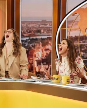 Andrea Savage Instagram - I can’t tell you yet what is happening in the second pic, but if it doesn’t get cut from the show it will def be a first for any talk show. You can imagine!!🤣😳 I had soooo much fun doing the news and talking @tulsaking (premiering this Sunday Nov 13th only on @paramountplus !!) on The Drew Barrymore Show with @drewbarrymore and @helloross I love a happy show ❤️❤️ (And this @zimmermann dress 😍😍) Catch it it today November 10th at 9:30AM ET/9:00AM PT on @cbstv !! @thedrewbarrymoreshow  #tulsaking  Styling: @taraswennen  Makeup: @rebeccarestrepo  Hair: @matthewmonzon  Dress: @zimmermann  Shoes: @louboutinworld