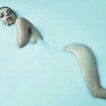Angela Sarafyan Instagram - “Skin Deep” 🥛 Loved this Collab with @robertascroft We met years ago at the Emmy’s, where he’d taken this stunning photo in the @csiriano starry night gown. We stayed in touch to think of what may be a creative collaboration we can get involved in together. He mentioned he had an idea for a long time he was hoping to explore and … it evolved into our shoot that you can see here. Sterility & Softness in lighting, the involvement with music and dance … it was a moment in time captured on film. Enjoy!