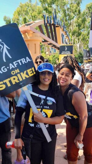 Anika C. McFall Instagram - On the front line once again on Foenem It’s National Day of Solidarity!! #sagaftrastrong #wgastrong 
#BENDINGCORNERSWITHANIKA

✨#Disney you’re up! Let’s Gooo 🏃🏾‍♀️ 
Standing strong w/ my girl @joannarhambo and dragged my girl Cat down my rabbit hole 😆her first time at Disney & glued to her phone lol
My dude @phredericsemaj bringing in the cowboys and cowgirls 🐎

✨Side by side @sagaftra @wgawest We press ON 🦾

✨#fair #contract #anikamcfall #multi #award #winning #actress #producer #writer #muse #blowkissesandthrowglitter #givegoodface #finerwomanhood #catchonorcatchup