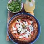 Annabel Crabb Instagram - Breaking: There is now a very satisfying nuclear escalation going on among my children re breakfast in bed. My 17yo, a naturally competitive tyke, learned of yesterday’s fish finger sandwich delivery by her puny sibling and has returned serve blisteringly with this Dutch Baby featuring smoked salmon, whipped cream cheese w capers, cornichon, thyme, lemon zest, green olives and served with a rocket salad and an apple and elderflower spritz on the side. All just ridiculously delicious… all eyes on the 14yo now. And on the 11yo who is away on a sleepover and will shortly return to find her palace of breakfast dominance memorably ransacked OMG. Swipe for further plating photography also the moment last night when - going to bed - I formally acknowledged that the book pile is getting a bit too tottery.