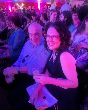 Annabel Crabb Instagram - This is my beautiful friend Eran Svigos - artist, raconteur, inventor of the aerosol cocktail, shoe fetishist, jewellery designer and co founder of @palasjewellery… She has been gone longer now, I realised today, than I knew her. But while she lived, she was possibly the MOST alive person I’ve ever known. And she leaves a sparkly trail of jewels and art behind. And her beautiful family (sister Anna, pictured next) and Dad John and Mum Esther, have for the last 16 years passed Eran’s generosity forward by funding a Fringe award in her name for the best solo visual arts show in Fringe. I was so proud to be able to be there today and present it, wearing some old and new Palas fingerbling. And thrilled to open the envelope and find the award went to @samkissajukian - like Eran, a multitalented wonder who makes - apart from comedy about bipolar, which makes me love him even more - giant wonderful paintings that I KNOW Eran would have loved. Everything I see of his I think my own late brother @jamescrabb12 would have loved, too. Heart full. Eran: you are missed and very single day and you would be CARVING UP this @adlfringe ❤️