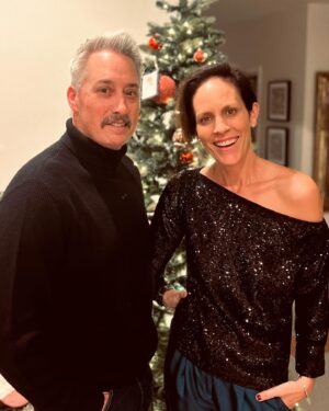 Annabeth Gish Instagram - This is us trying to take our yearly Christmas pic last night and Wade literally keeping arms length to avoid the glitter powder I used for more holiday sparkle. Glitter is not always a gift;) Happy Holidays!!! @donutshoppeproductions