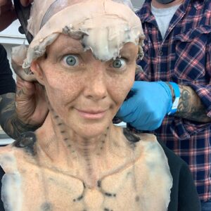 Annie Wersching Instagram - Sick of #Picard posts yet? 
😉👑👽Never, you say?! Great! 
In honor of our panel at @wondercon today, this one goes out to the incredible artists who designed, executed and applied this tricky prosthetic.  In the beginning I was called 4 hours before I was due on set. That included everything…hair in a bun, bald cap, crown on, 10 overlapping prosthetics, airbrushing and hand painting. Then costume and corset and all the rest. We very quickly got the whole shebang down to 2 1/2 hours! I’d go film some snarky BQ scenes and then it would take about 25 mins to remove the makeup pieces. I would let my hubs/family know I was almost finished by sending one of these ridiculous pics of prosthetics being cut off my face! 🤣 Some of my favorite times throughout my whole #StarTrekPicard experience were sitting in the chair being worked on by @jrmackinnon amd @kevinkirkpatrickart. I mean….what talent! And what great humans.❤️@vincentvandykefx and his team created piece after piece and @nevillepage was the concept artist for the whole thing! They did all of this while under the strictest of Covid protocols. I applaud them tremendously and I’m sure they’ll win lots of Emmys. 🏆 As they should! 
Don’t even get me started on @christineclarkdesign and @syzygy_designs and their ridiculously amazing detailed fittings and BQ costume…We’ll save that for next week ;) @startrek @startrekonpplus #picardbts