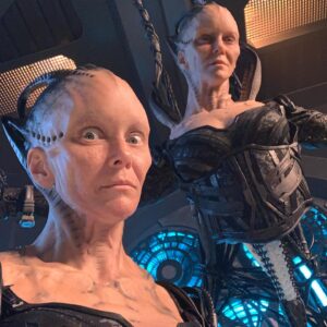 Annie Wersching Instagram - Sick of #Picard posts yet? 
😉👑👽Never, you say?! Great! 
In honor of our panel at @wondercon today, this one goes out to the incredible artists who designed, executed and applied this tricky prosthetic.  In the beginning I was called 4 hours before I was due on set. That included everything…hair in a bun, bald cap, crown on, 10 overlapping prosthetics, airbrushing and hand painting. Then costume and corset and all the rest. We very quickly got the whole shebang down to 2 1/2 hours! I’d go film some snarky BQ scenes and then it would take about 25 mins to remove the makeup pieces. I would let my hubs/family know I was almost finished by sending one of these ridiculous pics of prosthetics being cut off my face! 🤣 Some of my favorite times throughout my whole #StarTrekPicard experience were sitting in the chair being worked on by @jrmackinnon amd @kevinkirkpatrickart. I mean….what talent! And what great humans.❤️@vincentvandykefx and his team created piece after piece and @nevillepage was the concept artist for the whole thing! They did all of this while under the strictest of Covid protocols. I applaud them tremendously and I’m sure they’ll win lots of Emmys. 🏆 As they should! 
Don’t even get me started on @christineclarkdesign and @syzygy_designs and their ridiculously amazing detailed fittings and BQ costume…We’ll save that for next week ;) @startrek @startrekonpplus #picardbts
