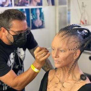 Annie Wersching Instagram - Sick of #Picard posts yet? 
😉👑👽Never, you say?! Great! 
In honor of our panel at @wondercon today, this one goes out to the incredible artists who designed, executed and applied this tricky prosthetic.  In the beginning I was called 4 hours before I was due on set. That included everything…hair in a bun, bald cap, crown on, 10 overlapping prosthetics, airbrushing and hand painting. Then costume and corset and all the rest. We very quickly got the whole shebang down to 2 1/2 hours! I’d go film some snarky BQ scenes and then it would take about 25 mins to remove the makeup pieces. I would let my hubs/family know I was almost finished by sending one of these ridiculous pics of prosthetics being cut off my face! 🤣 Some of my favorite times throughout my whole #StarTrekPicard experience were sitting in the chair being worked on by @jrmackinnon amd @kevinkirkpatrickart. I mean….what talent! And what great humans.❤️@vincentvandykefx and his team created piece after piece and @nevillepage was the concept artist for the whole thing! They did all of this while under the strictest of Covid protocols. I applaud them tremendously and I’m sure they’ll win lots of Emmys. 🏆 As they should! 
Don’t even get me started on @christineclarkdesign and @syzygy_designs and their ridiculously amazing detailed fittings and BQ costume…We’ll save that for next week ;) @startrek @startrekonpplus #picardbts