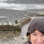 Anthea Turner Instagram – Our last day and Devon gave us bracing rain – Didn’t dampen our spirits !! 

After the beach dried off with a great pub lunch in The Wreakers Bar at The  Hartland Quay Hotel. 

Then with huge reluctance packed for home and said goodbye @berry.barn.hartland . 

So good to be together now looking forward to our next adventure. 

Raincoat – @ilsejacobsen 
Had it for a few years and an investment I’ll never regret ☔️