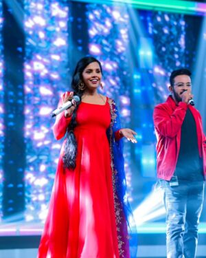 Aparna Narayanan Instagram - 🎤✨ Bringing the stage to life, one electrifying moment at a time! 🎶💃📸 These candid captures embody the pure bliss I feel when I'm performing for an incredible audience. 🙌❤️ 

Credits :
Photo - @magicmomentsphotography.in 
Costume - @_gina_couture 
Makeup & hair - @blushwithanki 
Earrings - @gina_fashionbling 

Also, it's raining red on my insta posts 😜

#performer #aparnanarayanan #stage #performance #singer #supersinger #ss9 #vijaytv #vijaytelevision #red #weekend #sunday #happy #love #musician