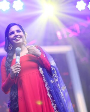 Aparna Narayanan Instagram - 🎤✨ Bringing the stage to life, one electrifying moment at a time! 🎶💃📸 These candid captures embody the pure bliss I feel when I'm performing for an incredible audience. 🙌❤️ 

Credits :
Photo - @magicmomentsphotography.in 
Costume - @_gina_couture 
Makeup & hair - @blushwithanki 
Earrings - @gina_fashionbling 

Also, it's raining red on my insta posts 😜

#performer #aparnanarayanan #stage #performance #singer #supersinger #ss9 #vijaytv #vijaytelevision #red #weekend #sunday #happy #love #musician