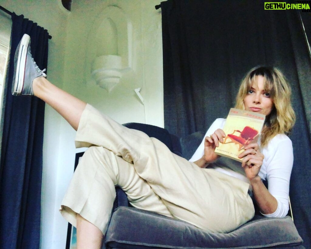 April Bowlby Instagram - Kick up your feet and give a listen to @75reads first half of The Leopard, #66 on Bowie’s reading list. @jobozarth found Bowie in the authors drive and creative push and outlook. I found Bowie in one of the books characters. Where do you find Bowie? Politics, romance, and the inability of one to look beyond ones self. Guys. I loved it. #bowie #75reads #bookclub #podcast 🍑📚