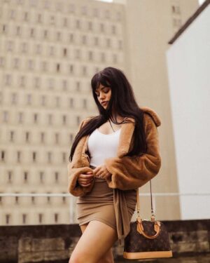 Ariel Yasmine Instagram - It may not be sunny in Miami but blessings still be shining down on me ⛅️ PC: @2kpictures  Coat   Skirt @revolve #revolveme