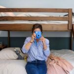 Ashley Williams Instagram - “My name’s Gus and I like small spaces,” my nine year old used to introduce himself to people this way. He loves reading, drawing, and “being cozy,” so when we considered designing a bedroom for him, the only answer was this mahogany treehouse vibe. We went to @roomandboard and had the best time designing exactly to his sensibility. He loves to sit at his desk and “imagine that I’m in the forest.” I’m obsessed with Room and Board’s sturdy, clean lined aesthetic and sometimes on stressful days I go hide in there myself. 😆 #homerenovation #kidsroom @we_are_kismet @alchemy_collective_ #roomreveal #ad