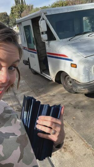 Ashley Williams Instagram - My mother used to keep the Christmas tree up till Easter. “Oh come on, it’s pretty!” She’d say. 
Let’s normalize doing whatcha can. We sent our Christmas cards out TODAY. Our cards are beautiful and from our heart and… late. But we did it! And I feel good about that. Special shoutout to bob the mailman for being the best ever. And Aunt Nancy for helping us stuff em by the fireplace last night!! Let’s go 2024!! @nancezav #mailman #christmascard