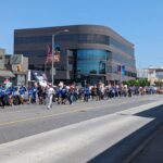 Ashly Burch Instagram - A picture of the Mere Mortals writers unofficial mascot Cody out on the picket line from a few weeks ago. And a picture of the rally last Wednesday. We're still out here, goin' strong!