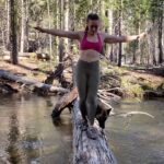 Aspen Ladd Instagram - I have the worlds gamest adventure buddies ❤️ usually you can walk across this river . But this time of year with Kaia ( my old dog) it’s too deep and the currents too strong, so we take whatever log we can find. I had just helped her across right before this moment here 🙂 these 2 are ridiculously athletic and can swim the current no problem. Kylo will even tow me if I ask him or he will get stressed out by me being in deep water and then come drag me out wether I want him too or not . They are good pups