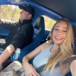 Aurora Culpo Instagram – Roses are red, this Aston Martin someone (should not have) let jackson drive is blue, In-N-Out is overrated and so was Dune 2🤸‍♀️💙😎