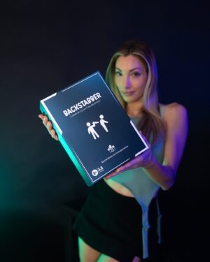 Avori Henderson Instagram - Backstabber: A game of loyalty and deception ⬇️

I started creating this game with sticky notes back in 2023 (swipe right to see). Those sticky notes eventually turned into a beautiful board game that is releasing June 14th. 

I created this game based off of my experience on deception reality tv, from my series ‘The Mole’ and my favorite games like ‘Clue’ and @amongusfeed 

The game will be announced on the @gameconcanada mega stage along with a BIG SURPRISE 😮 

So get ready…. it’s time to bring chaos to your living room 😏 🔪 

ALSO: The First Edition only comes in 1000 units that feature a special Game Con Canada token along with special branding!

Additionally, 10% of all board game profits go to my nonprofit partner- GiftofGaming which provides gaming systems to children’s hospitals!

#games #boardgames #familytime #gaming #gamer #game