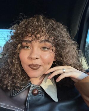 Bailey Bass Instagram - Peek-a-boo. Sustainable fashion got me posting in feed again. Thank you so much @coach for having me. So fun celebrating the DOPEST @coachtopia ;)

p.s. the outfit I’m wearing was made using reused leather💋

p.s.s. I’m also proud to be a new mama to some propagating beauties🌱

Congrats to @mayasideas and @lola.tung and the rest of the sustainable girlies on the @coachtopia campaign !!!

Glam… @jofrancoartistry & @cheryltbergamyhair 

#coachtopia