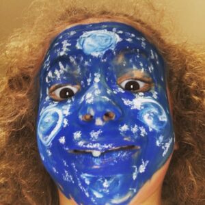 Beth Littleford Instagram - Hallie double-pickle-dared me to “post it on Instagram. “ She snuck off with some blue paint did Starry Night on her face then took this selfie. She’s sticking out her one remaining front tooth for a just a smidge more crazy.
