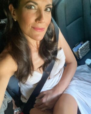 Bettina Zimmermann Instagram - First Night out..... on my way to the Raffaello summer dinner @Raffaello #raffaellosummerdinner .....Auch im Abendkleid immer schön anschnallen😉 dress Versace Couture Vintage @versacejeanscouture @versace @aigner Vintage bag // Werbung wegen Markennennung