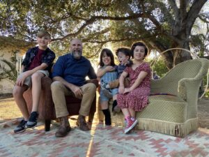 Briana Renee Instagram - Happy Thanksgiving from the Manning clan 🍽🤎🧡💚🍁 I am thankful for this moment, for us, for my parent’s, my sister, and exceptionally talented brother-in-law (@jetsforhire) ~ who made this shot happen with an iPhone 11 #nofilter. Thankful for the fact that this day marks 11 months out of the hospital, and for the strength & resilience within my ‘village’. Grateful for my husband who is the most patient, unconditionally loving, and kind-hearted man. My kids are the funniest, sweetest, and most loving free-spirited empaths; who have grown, and shone in their most beautiful & unique ways ♥️ #thisisus #Manningpartyof5 #thesearethemoments #proudestmama #HappyThanksgiving
