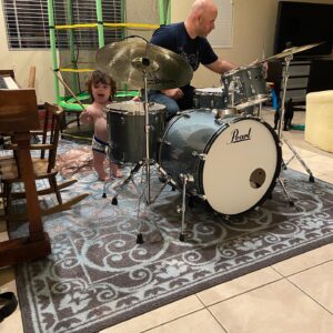 Briana Renee Instagram - Happy Valen-time’s with my handsome Valentine’s 💙🤘🏻 How we celebrate : Go to @guitarcenter, buy a drum set for my most deserving hubby, eat some pizza (him) and a sandwich (moi); then enjoy the night with drum play and snuggles 💙 Maverick has found his “spark” 🥁 #happyvalentinesday #Manningstyle #myhandsomes #truelove #letsmakemusictogether #musical #therealreasonifellinlovewithhim 😘