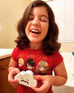 Briana Renee Instagram - My pretty Valentine 💜 loves her happy cloud @ribivaul_bathbombs l~ they literally release a rainbow, and that face doesn’t get any cuter ☁️🌈👉🏻 #growingtoofast #beautifulgirl #tallerthanme #proudmama #happyvalentine #ribivaulbathbomb