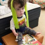 Briana Renee Instagram - This is our Maverick by definition ~ {rebel with a good heart, who beats to his own drum} 💙 Currently he is watching Ugly Dolls - which he calls “yellow green pink” - with all of his relaxing essentials. 😅😜♥️ Everyday he learns, and teaches us, something new. The journey has been bumpy, stressful at times, but he is a beautiful ray of light and smiles (and those eyes melt my heart, every time)! He is brilliant, resilient, resourceful, and very musically inclined. I am so grateful that all of our kids have stayed relatively healthy through this pandemic, but I haven’t always handled Maverick’s high-pitched screaming stims well at all. I’ve yelled, I’ve cried, I’ve closed myself in the closet just to have 3-5 minutes of quiet. We got the diagnosis coming up on 1 year ago, and then 2 months later - shutdown! This year I don’t have a resolution, but rather a change of mindset. I will focus on gratitude and positivity, and take all the quiet closet breaks I need without feeling guilty lol. This is high functioning autism ❤️💛💙🤍 and I couldn’t have survived this last year without my amazingly supportive, loving, and patient beyond measure husband @manning_party_of_5 📸 #2/365 #MaverickJax #mamasboy #autismmom #onedayatatime