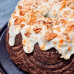 Briony May Williams Instagram – Spice up your life with this next delicious instalment in my Super Seasonal Recipe Series ❤️ This time we’re celebrating the humble carrot 🥕 This Spiced Carrot Bundt Cake is so packed with flavour and takes the carrot cake to the next level. I’ve made a Bundt but you can use a loaf tin for this recipe 🥕 Let me know if you give this gorgeous cake a try! ❤️ #seasontotaste

Ingredients
320g carrots, grated
100g pecans, chopped
100g raisins
300g plain flour
2 tsp bicarbonate of soda
2 tsp ground cinnamon
1 tsp allspice
1 tsp ginger
1 tsp salt
300ml vegetable oil
4 large eggs
1 tsp orange extract
200g golden caster sugar
200g light brown sugar

Icing
150g cream cheese
100g icing sugar
2 tbsp lemon juice

Decoration
Crushed pecans
Orange zest

Method
1. Oven on to 180C fan/200C. Liberally grease and flour a bundt tin.
3. In a bowl, add the oil, eggs, orange extract and sugars. Mix well to combine.
4. In another bowl, add the flour, bicarb, cinnamon, allspice, ginger and salt. Whisk to combine.
5. Tip the oil mixture into the flour mixture. Mix until smooth. Add the grated carrots, nuts and raisins. Mix again then pour into the prepared tin. Bake for 1h10 until a skewer comes out clean. Leave for 10 minutes then tip onto a cooling rack.
6. Make the icing. Mix all the ingredients together until smooth then drizzle over the cake. Sprinkle over the crushed pecans.

#recipe #bundt #homebaking #homebaker #baker #baking #carrot #carrotcake #bundtcake #seasonal #easyrecipes #spicedcake #cakegoals