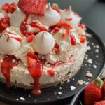 Briony May Williams Instagram - Fancy whipping up a blooming delicious summery no bake pudding that is minimal effort, maximum taste?!? Look no further!!! Try this No Bake Eton Mess Cheesecake 🍓It is a beauty!!!! No Bake Eton Mess Cheesecake Ingredients 200g chocolate chip digestive biscuits 75g unsalted butter, melted 400g cream cheese 150g icing sugar 250ml double cream 1 teaspoon vanilla extract 3 tbsp smooth strawberry jam To top 150g strawberries Meringue kisses 150ml double cream 3 tbsp smooth strawberry jam Method Bash the biscuits up using a rolling pin. Pour into a bowl then add the melted butter and mix. Pour into an 8 inch loose bottom cake tin. Place in the freezer for 10 minutes. Place the jam in the microwave for 10 seconds to loosen. In a bowl, whisk together the icing sugar and cream cheese. Pour the double cream and vanilla into another bowl and whisk to soft peaks then gently fold in 2 tablespoons of the strawberry jam. Fold together the cream cheese mixture with the whipped cream mixture until combined. Pour over the biscuit base then swirl through the remaining tablespoon of jam. Place in the fridge for a few hours or overnight to chill. To finish, remove the cheesecake from the tin. Whip the double cream until stiff peaks then divide into 2 bowls and fold a tablespoon of the jam through one of them. Hull and chop the strawberries. Top the cheesecake with the whipped creams, chopped strawberries, meringue kisses then drizzle over the remaining jam. #seasontotaste #strawberries #nobake #nobakecheesecake #nobakedessert #seasonalfood #seasonal