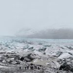 Brit Marling Instagram - it’s taken us 3 1/2 years to tell our next story from script to screen and it was a wild ride. i got hypothermia. then covid. twice. there were dust storms, blizzards, and 40 mph wind gusts sent our 4k lights rolling down the mountains. everyday felt like scaling a vertical cliff face but it was also an adventure with the most extraordinary people that I will remember for the rest of my life. and more often than not the fates conspired for us to capture something wild and alive to share with y’all… well, you’ll let us know…🕊️ @amurderattheend . we’ve missed you. keep your eyes peeled… (scaled up a hillside to take this pic of our crew on our first scout - the glacier of SVÍNAFELLSJÖKULL)